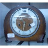 A mid 20th Century polished oak cased Smiths Enfield mantel clock with eight day gong striking
