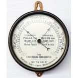 A 6¼" diameter brass bulkhead style cased "The Universal Barometer for Mariners, Agriculturists,