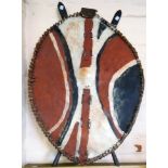 An African Maasai shield and two lion spear heads