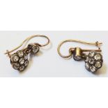 A pair of antique diamond cluster drop earrings on later yellow metal wires