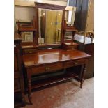 A 4' Edwardian walnut dressing table with triple bevelled mirrors, flanking shelves and trinket