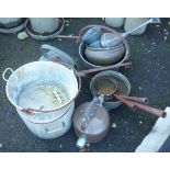 A collection of copper and brass pans, kettles, funnels, etc.
