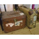 A vintage canvas and leather clad suitcase - sold with a similar transit case, both with old