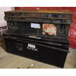 A 31" late 19th Century painted tin military uniform foot lockers with a selection of old shipping