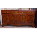 A 5' reproduction mahogany cross banded and strung sideboard with three frieze drawers and four