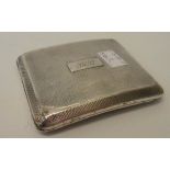 A silver cigarette case of semi-curved design and engine turned decoration - initialled