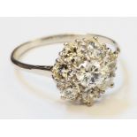 An unmarked white metal diamond cluster ring