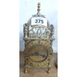 A 7¼" Smiths brass cased lantern timepiece with battery movement