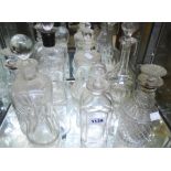 Seven cut glass decanters of varying design