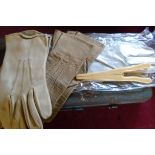 Three assorted pairs of kid gloves and an ivory effect glove stretcher