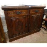 A 4' 1" Edwardian polished and carved oak base with two short drawers and pair of panelled