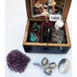 A musical jewellery box containing a quantity of marked "Sterling" and .925 white metal jewellery