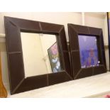 A 24" square pair of leather clad framed wall mirrors