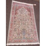 A silk Tree of Life rug, muted green, blue and orange on cream ground - 35½" X 5' (92cm X 155cm)