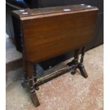 An Edwardian walnut Sutherland table, set on turned supports