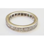 An unmarked white metal diamond set eternity ring - 1.30ct. TDW