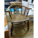 A smoker's bow elbow chair with solid elm seat, set on turned supports