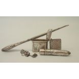 A small silver vesta case - Birmingham 1900 - sold with a napkin ring, needle holder, white metal