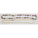 A single string cultured pearl necklace with 9ct. gold clasp - sold with a single string of coloured