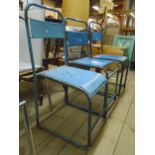 Three similar vintage metal framed stacking chairs, all with remains of painted finish