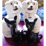 A pair of Staffordshire spaniels (one a/f) - sold with a pair of long necked black cats