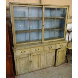 A 6' 2¼" old pine two part dresser with glazed top section, over a base with four drawers and