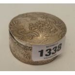 A 2¼" diameter antique Dutch style white metal trinket box with classical bathing scene to hinged