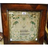 A framed early Victorian sampler dated 1839 by Jane Bradley aged 10 depicting green parrots,
