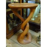 A 15¼" solid carved hardwood occasional table set on open twist base - chips to rim