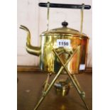 A brass spirit kettle on stand with burner