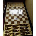 A boxed onyx chess set