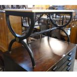 A 3' 6" oblong table, the ebonised X-frame base with simulated bamboo braces, ring turned