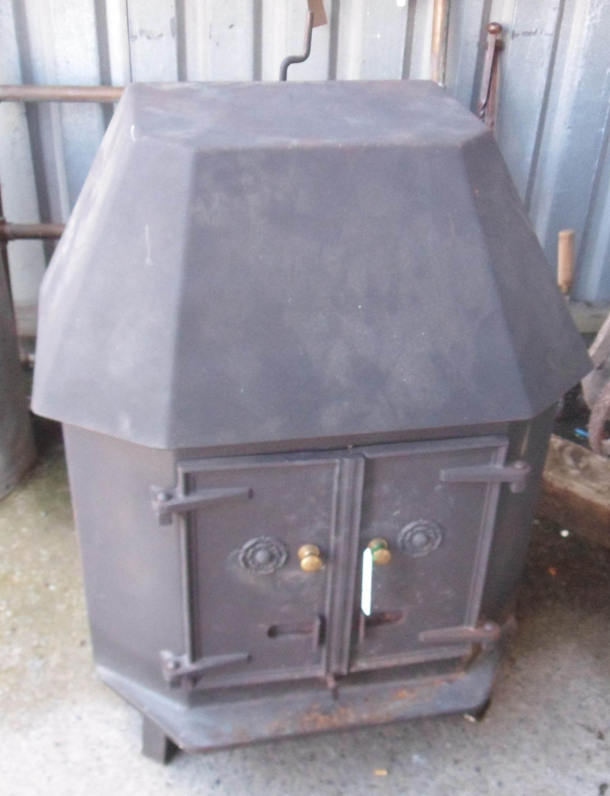 A modern cast iron wood burner with English Rose decoration - widest 26½" X highest 32½"