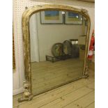 A 4' Victorian gilt framed overmantel mirror with original plate and remains of finish and gesso