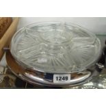 A plated Lazy Susan with moulded glass fitted dishes