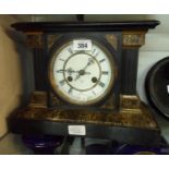 A late 19th Century simulated black slate and marble cased mantel clock with Junghans gong