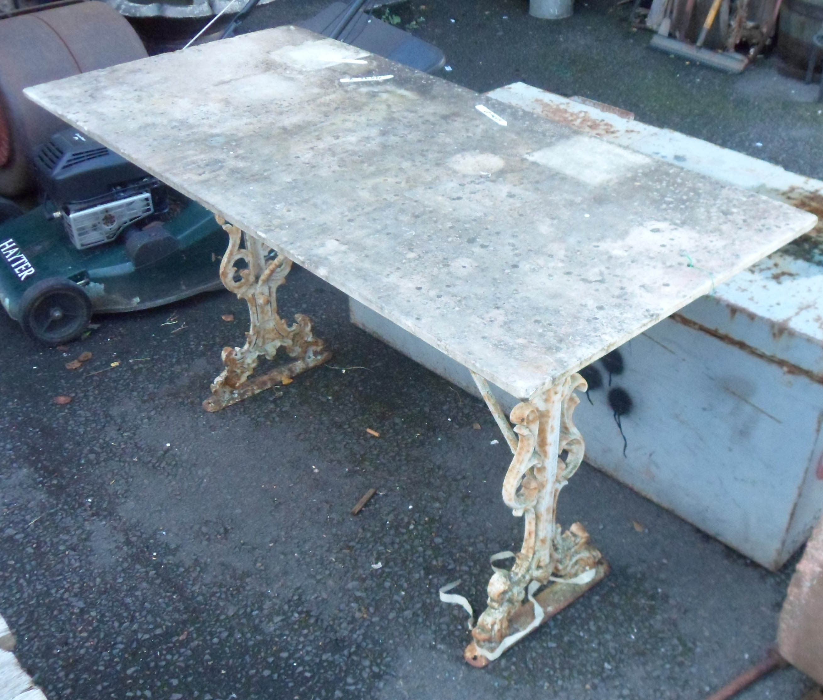 A 4' 2" marble topped table with painted cast iron base