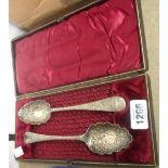 A cased pair of Victorian silver plated berry spoons