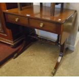 A 29½" early l9th Century mahogany sofa table with two frieze drawers, set on standard end with