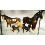 A collection of five Beswick horses including Palomino foal (a/f), shire and bay