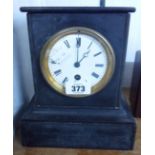 A late Victorian black slate cased mantel timepiece with eight day movement