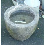 A 15½" diameter carved granite mortar