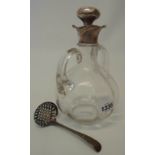 A blown glass two handled wine jug with milled base, silver double spout and original silver clad