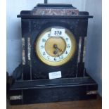 A late Victorian black slate and marble cased mantel timepiece with French eight day movement