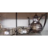 A pair of silver plated coasters with turned wood bases - sold with a silver plated coffee pot,