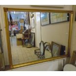 A modern gilt framed bevelled wall mirror - 33" X 3' 7"