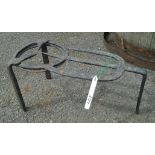 An antique iron hearth stand trivet