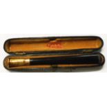 An early 20th Century Irish Patent era cheroot holder with 9ct. gold hallmarks for Kapp &