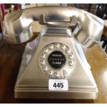 A vintage style polished metal Bombay Tiffany Classic telephone