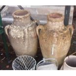 A pair of 30" high terracotta olive jar style garden pots with four loop handles